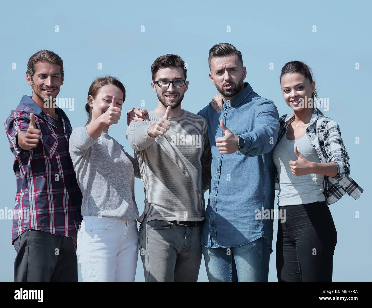group of young people showing thumb up Stock Photo - Alamy