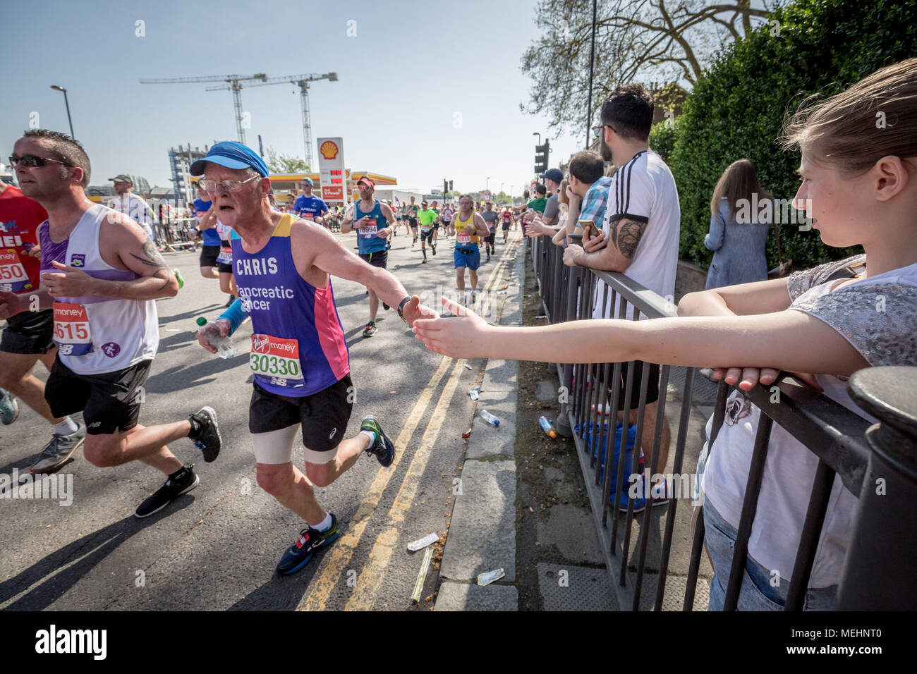 London, UK. 22nd April, 2018. 38th London Marathon passes through Deptford. Credit: Guy Corbishley/Alamy Live News Stock Photo