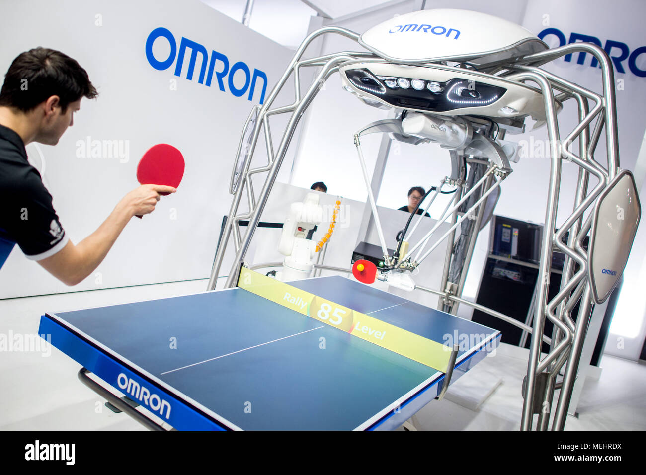 Hanover, Germany, 22 April 2018Table Tennis player, Dimitrij Ovtcharov,  playing against a robot at the Omron Stand during the Hanover Fair. Omron  is introducing new developments in the Field of artificial intelligence.