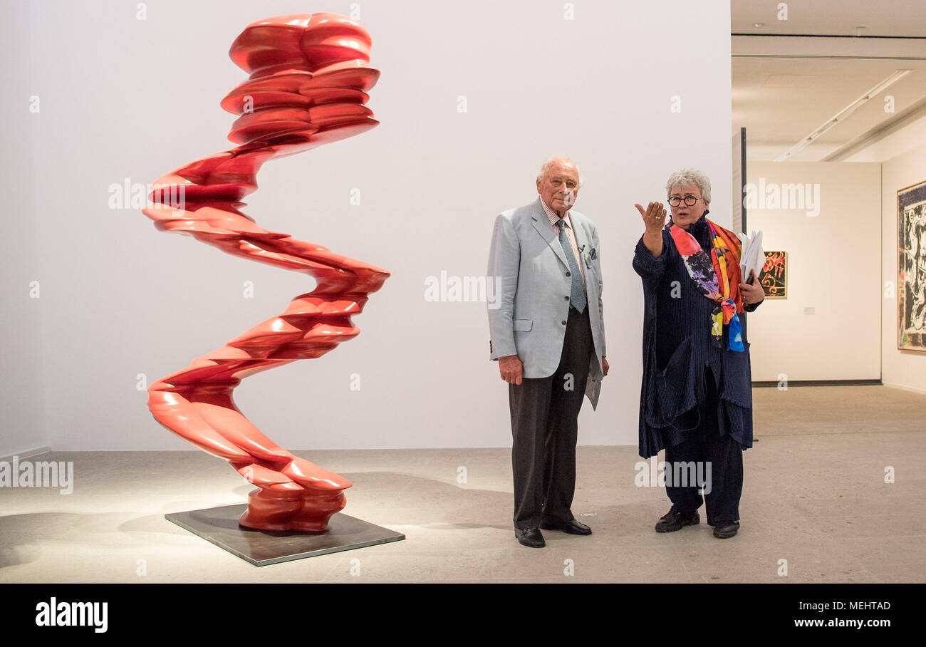 22 April 2018, Schwäbisch Hall, Germany:   Reinhold Würth (l), founder of the screw company Würth, and Sylvia Weber (r), director of the Kunsthalle Würth, stand in the Kunsthalle Würth next to the sculpture Red Figure during the opening of the exhibition 'Where to look - new insights the Würth Collection' by the artist Tony Cragg. Around 200 works created since the 1960s will be presented to the public for the first time in the new exhibition. The main focus is on painting and sculpture. The exhibition is open from April 23, 2018 until March 17, 2019. Photo: Sebastian Gollnow/dpa Stock Photo