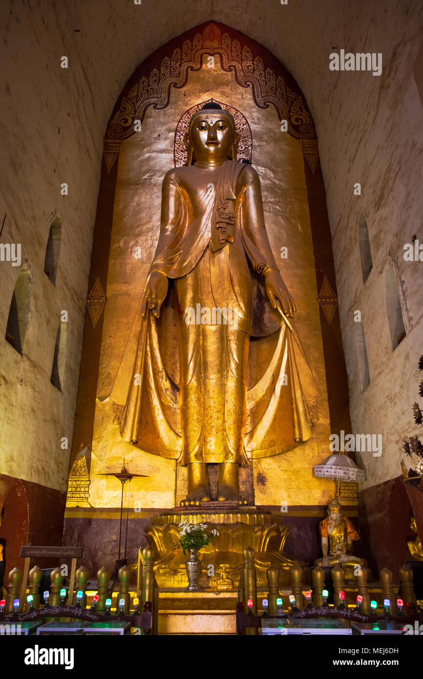 One of the four Buddha statues ('Konagamana', east facing) inside the 'Ananda Temple'. Bagan, Myanmar (Burma). Stock Photo