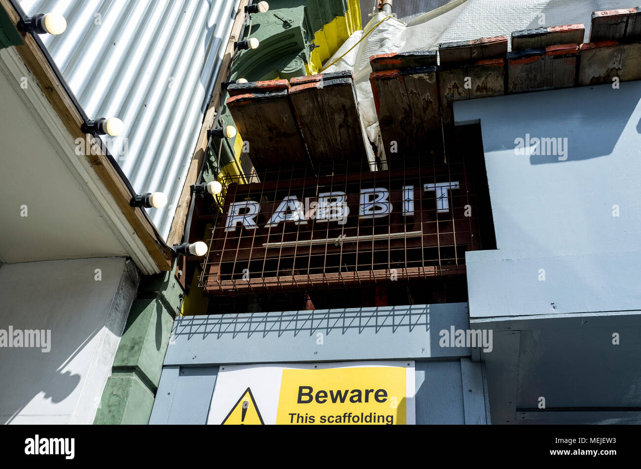 Sign reading 'Rabbit' next to building site in Chelsea, west London. Stock Photo