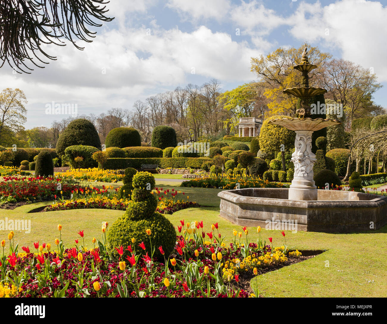 Stately home formal garden with fountain and folly Stock Photo