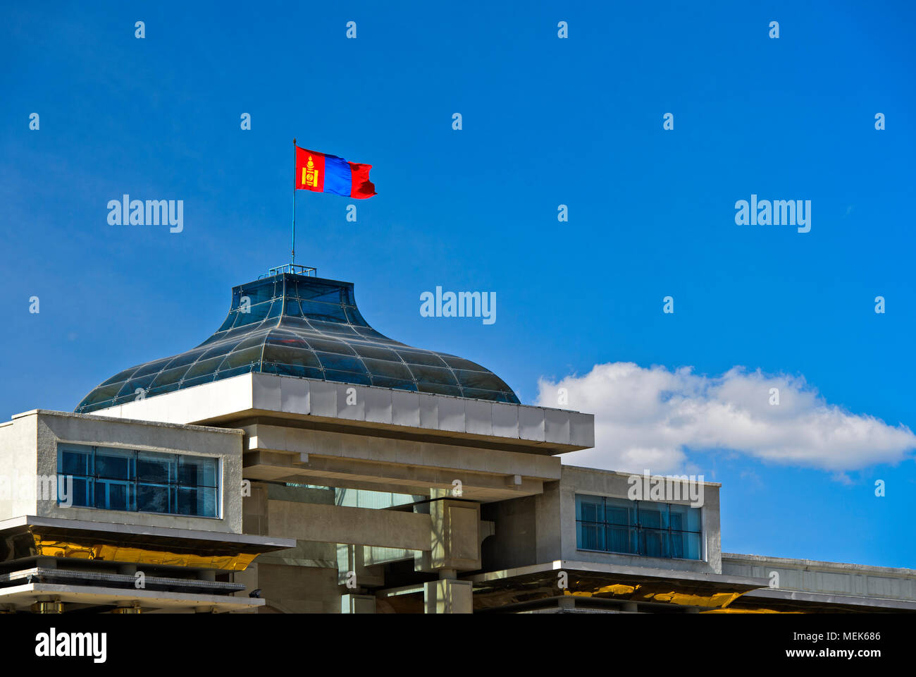 National flag of Mongolia with the Soyombo national symbol on the Parliament building at Sukhbaatar Square, Ulaanbaatar, Mongolia Stock Photo