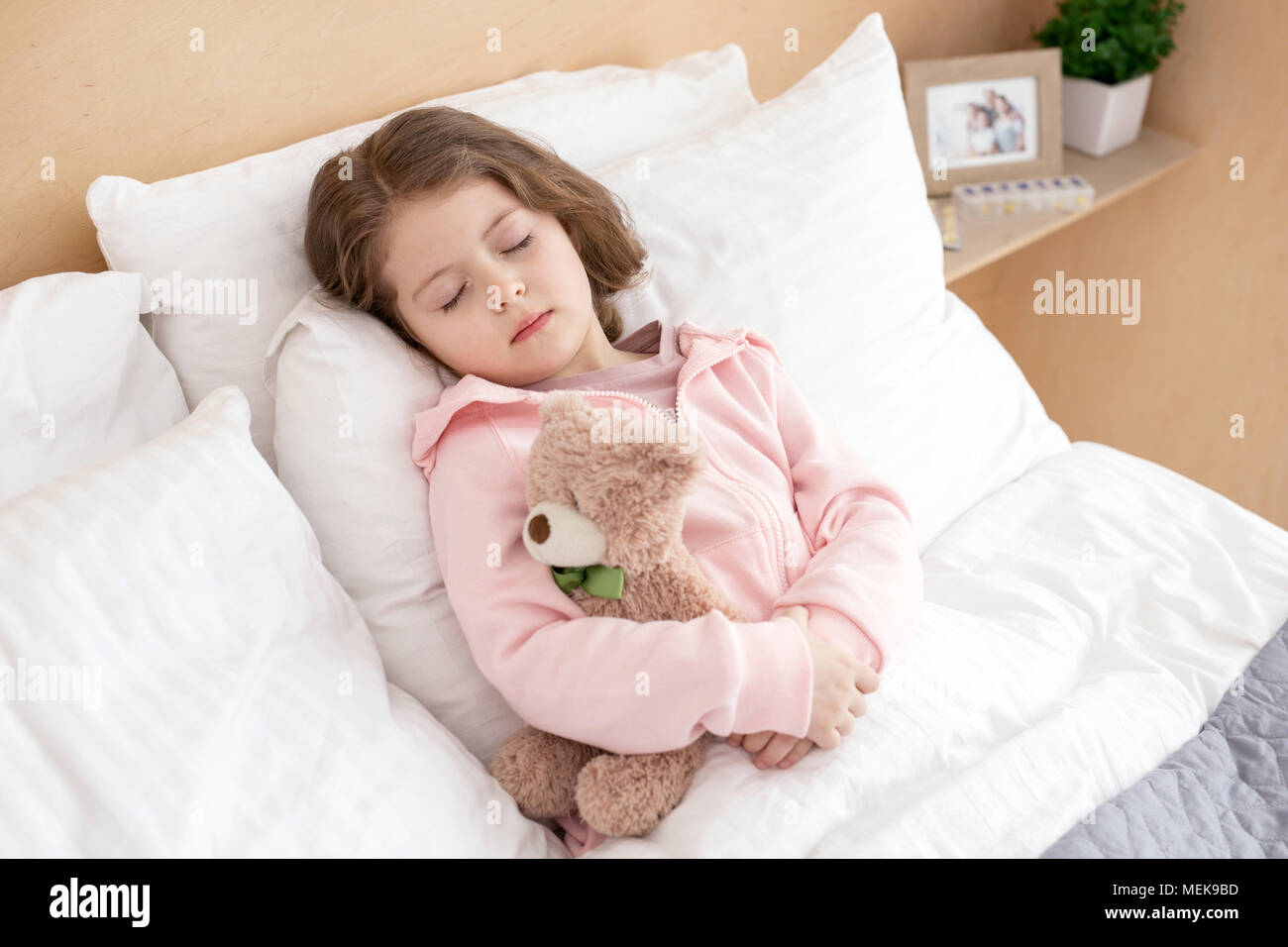 Charming girl sleeping in her bed Stock Photo - Alamy