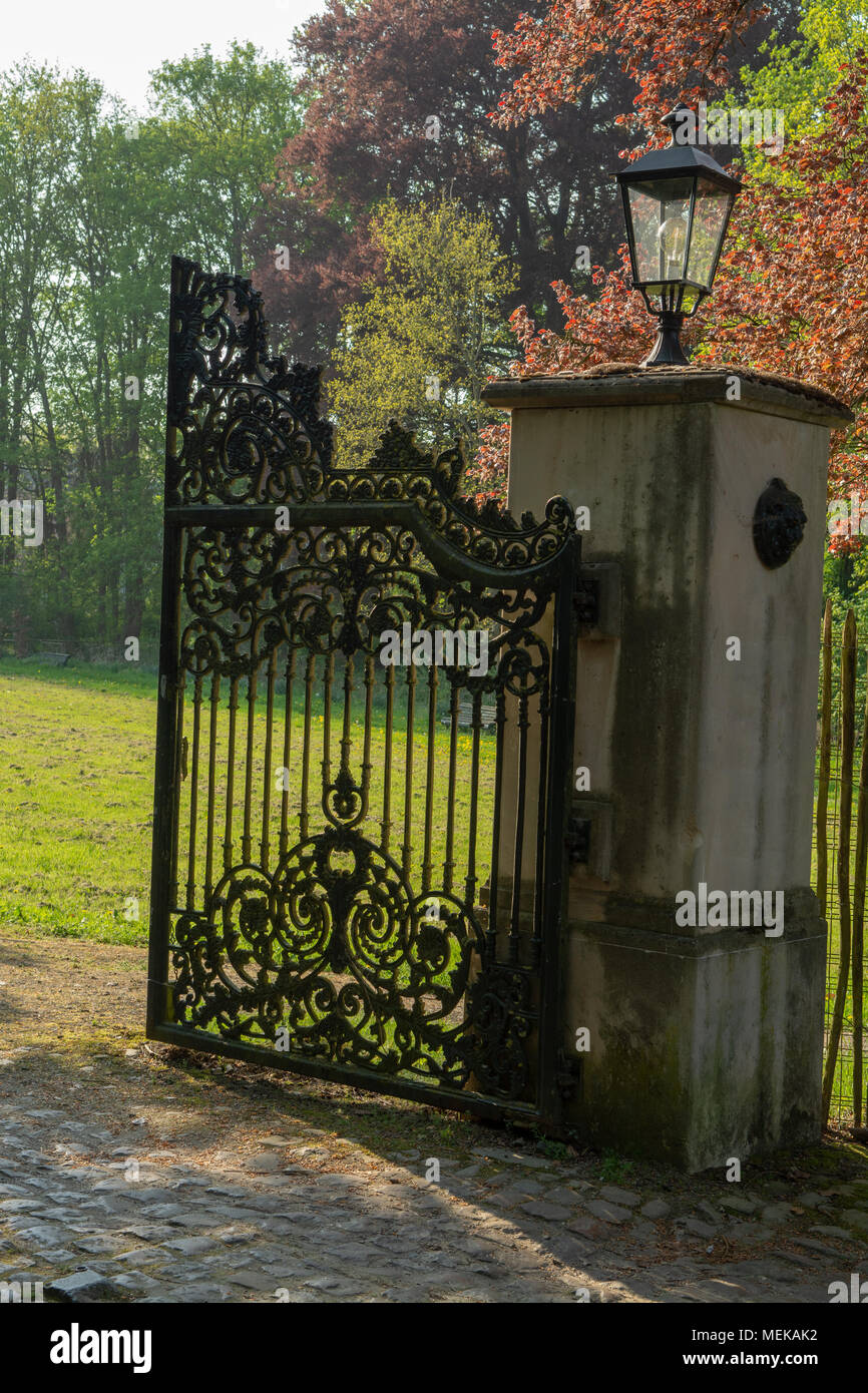 Open iron vintage entrance gates in old castle, sunny day Stock Photo -  Alamy, image size:866x1390