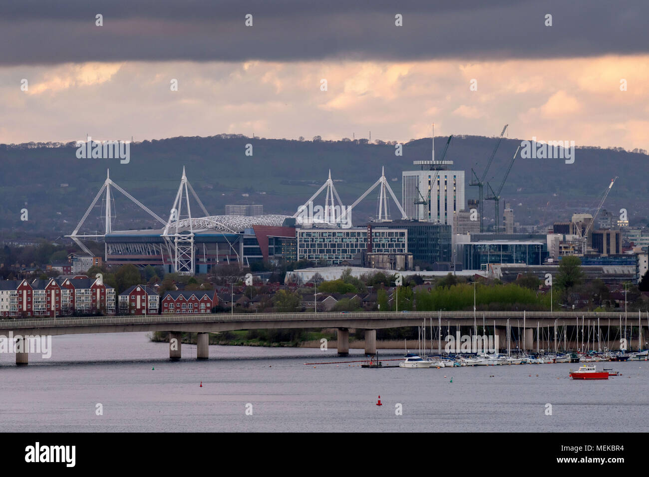 A general view of Cardiff City centre with dark, moody skies showing the Principality Stadium, formerly the Millennium Stadium and River Taff. Stock Photo