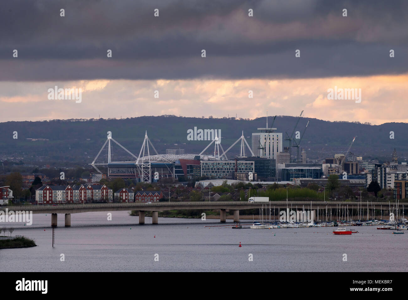 A general view of Cardiff City centre with dark, moody skies showing the Principality Stadium, formerly the Millennium Stadium and River Taff. Stock Photo