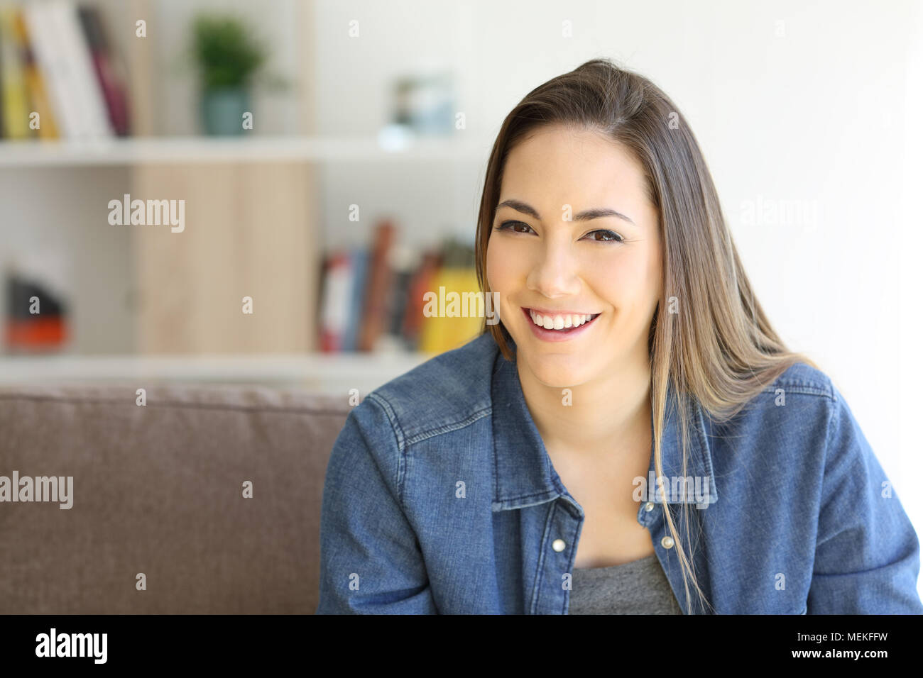 Front view portrait of a happy woman posing looking at camera with ...