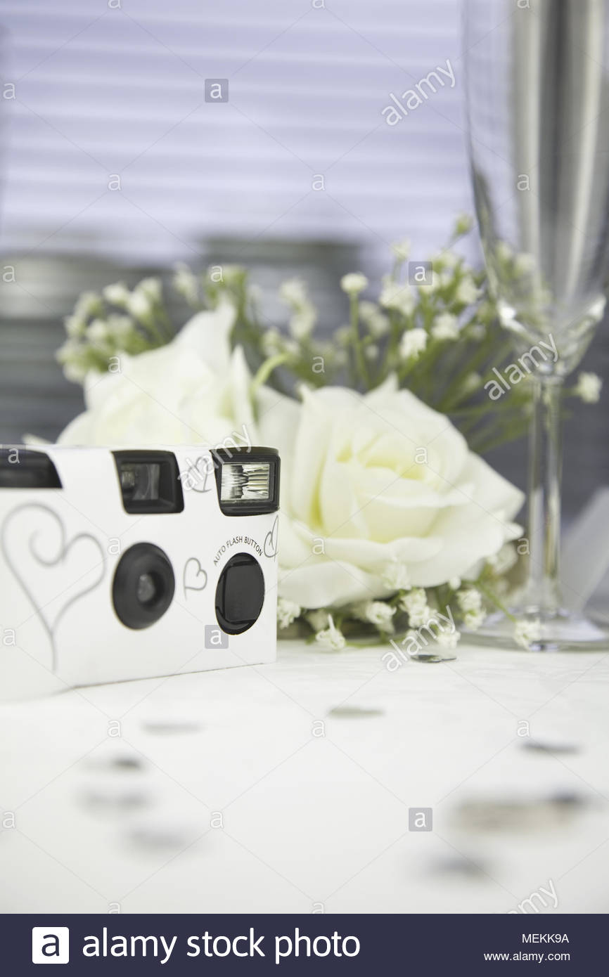 Disposable White Wedding Camera On A Wedding Table Stock Photo
