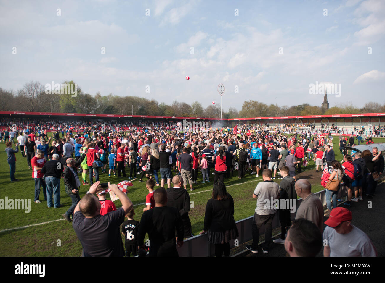 Fans celebrate after Salford City FC are crowned Champions of the