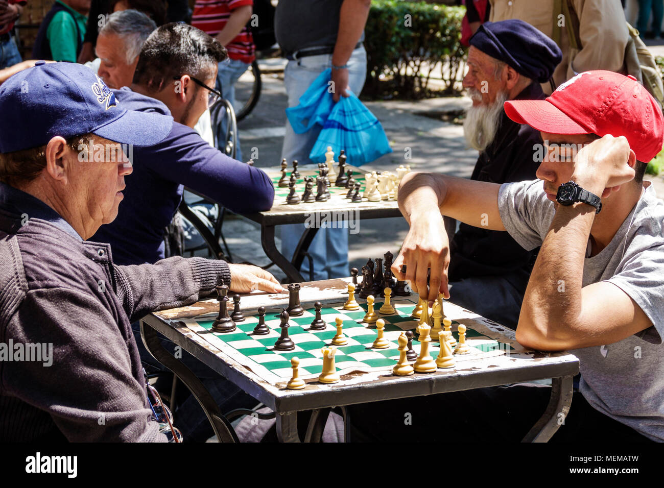 Mexico City,Mexican,Hispanic,historic Center Centre,Avenida Juarez,Plaza de la Solidaridad,public square,chess,game,playing,moving pieces,man men male Stock Photo