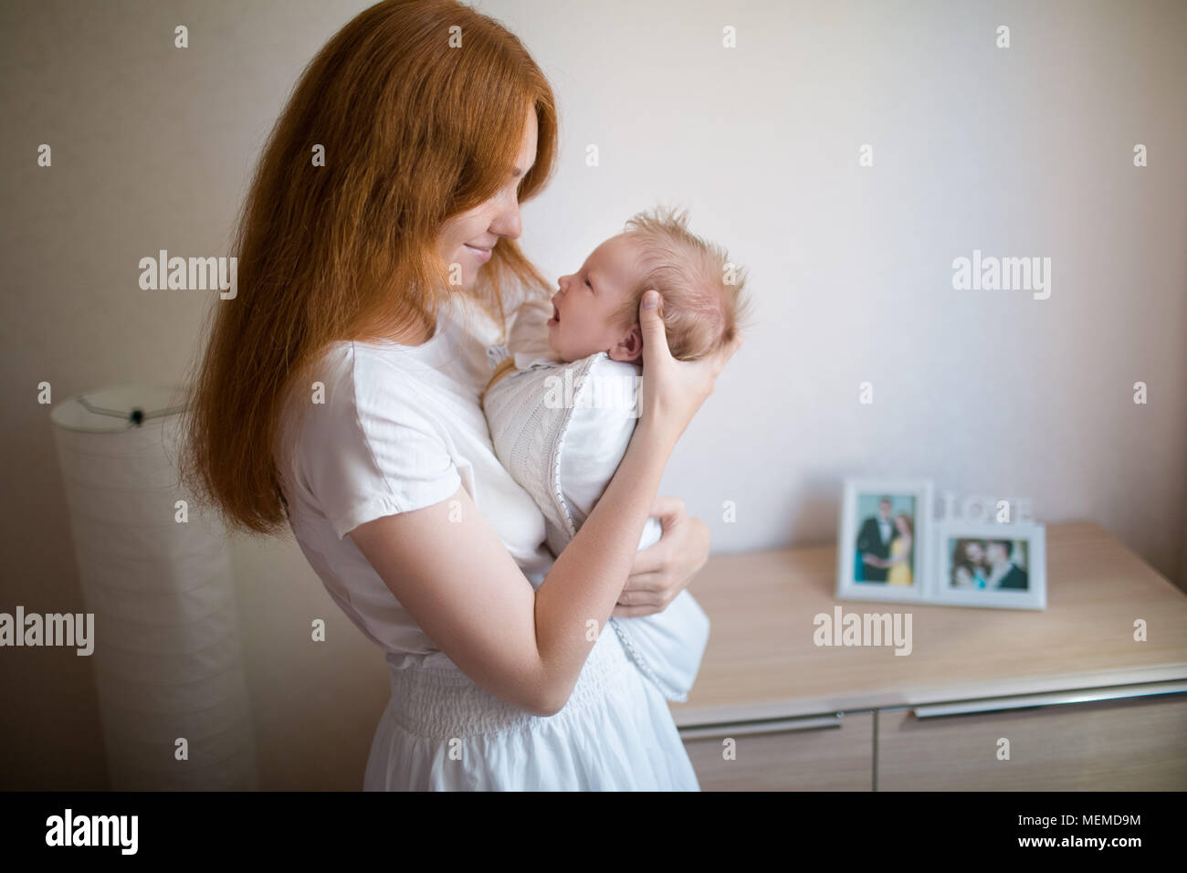 Mom is holding a newborn baby Stock Photo