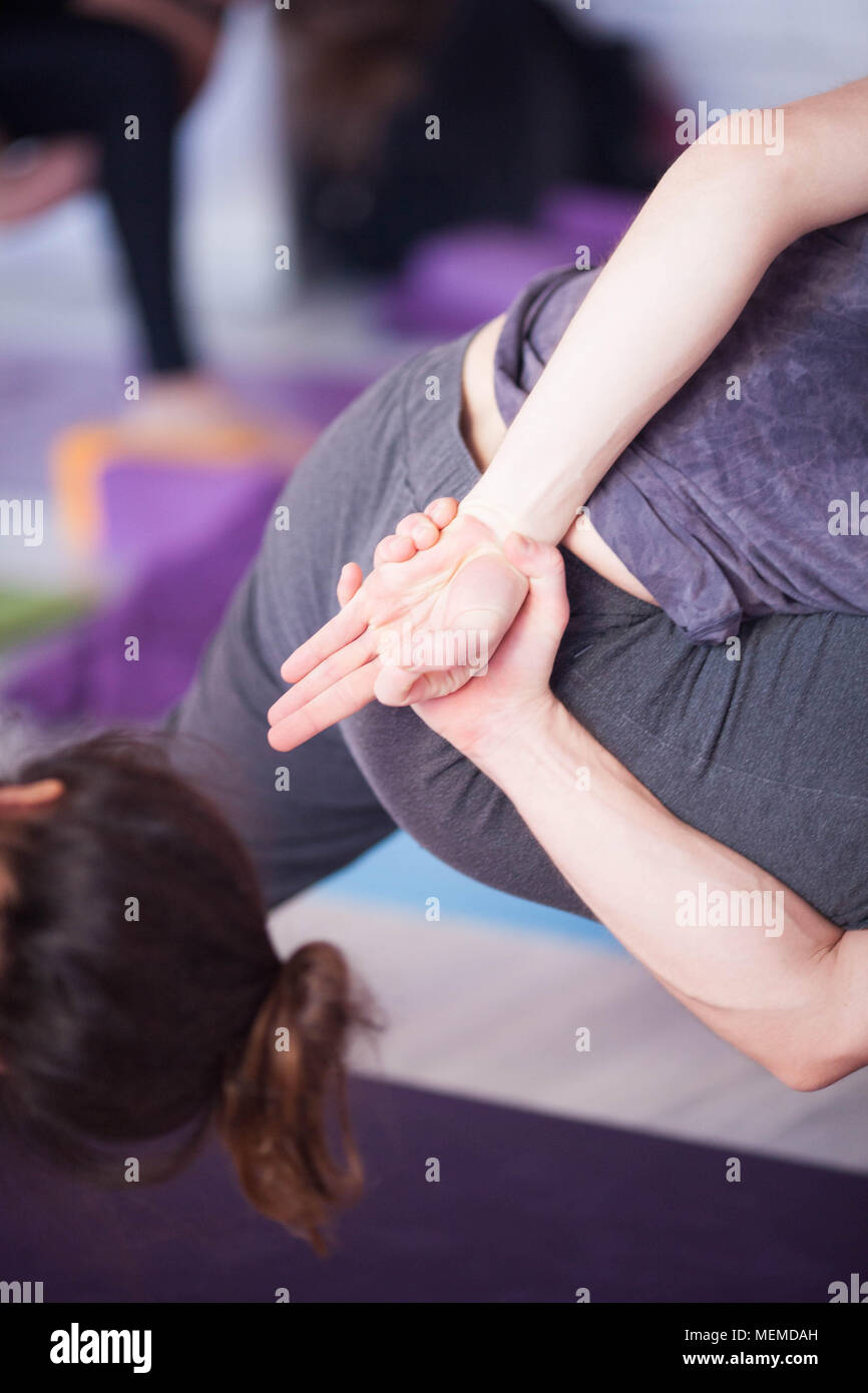 Asana and mudra performed by a man. Stock Photo