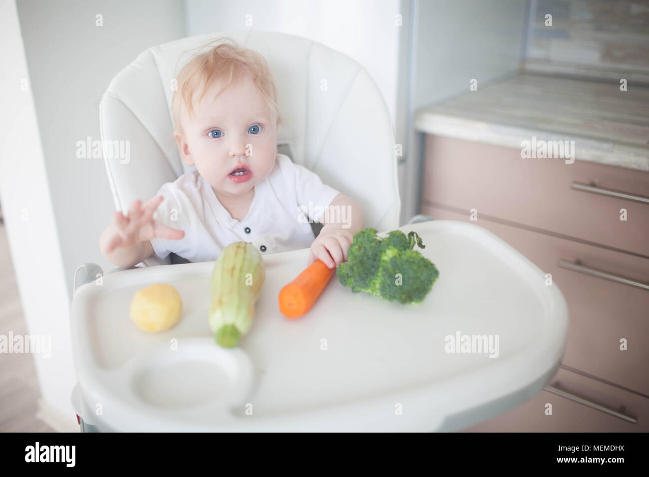 The baby is eating vegetables Stock Photo Alamy