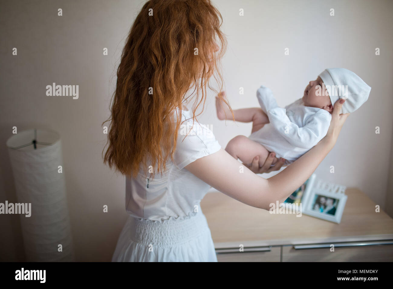 Mom is holding a newborn baby Stock Photo