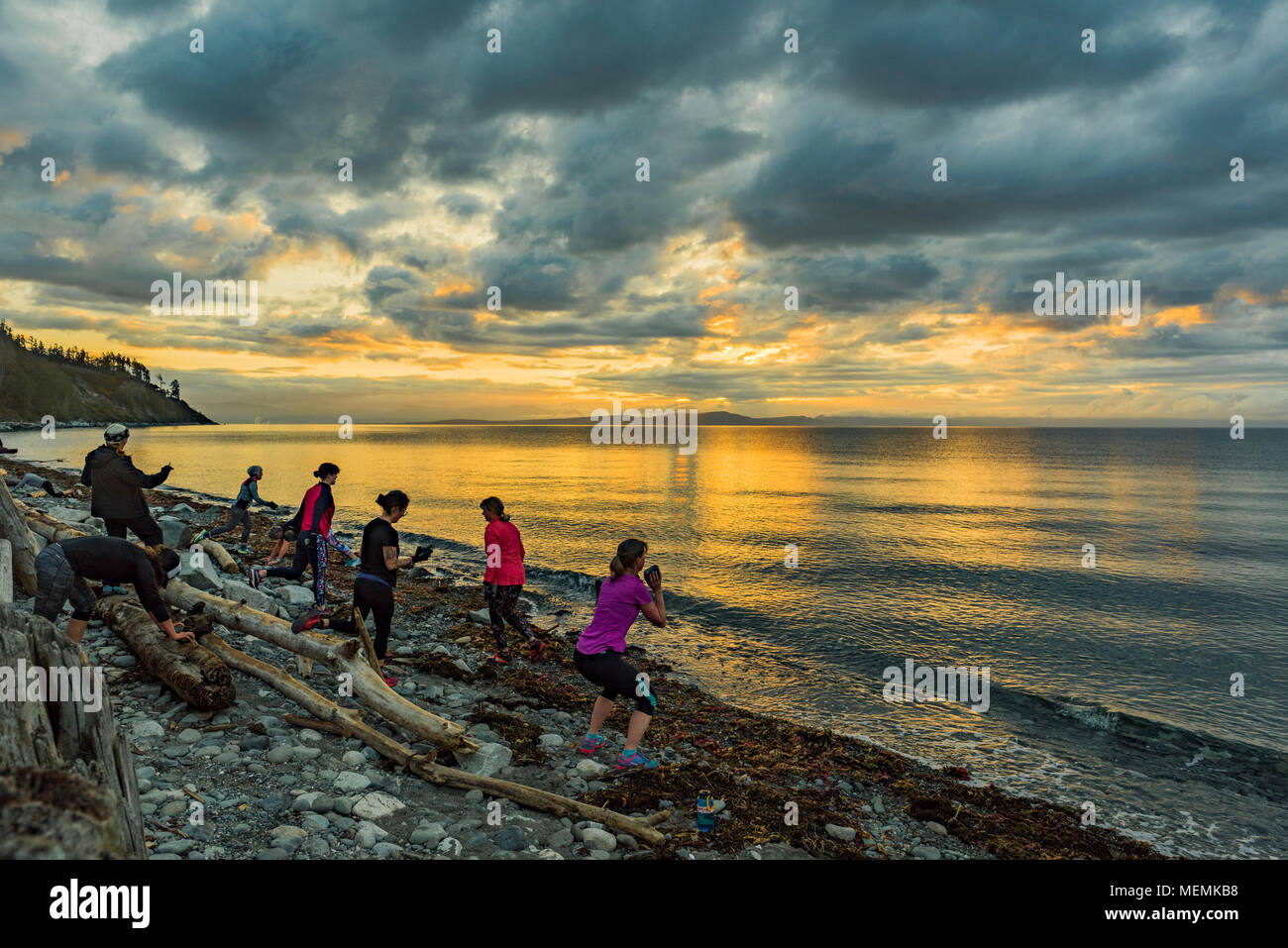 Morning exercise boot camp, Goose Spit Park, Comox, British Columbia, Canada. Stock Photo