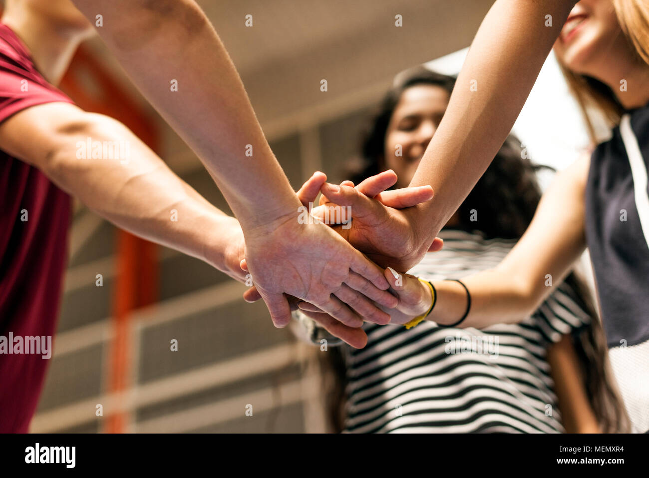Group of teenager friends on a basketball court teamwork and togetherness concept Stock Photo