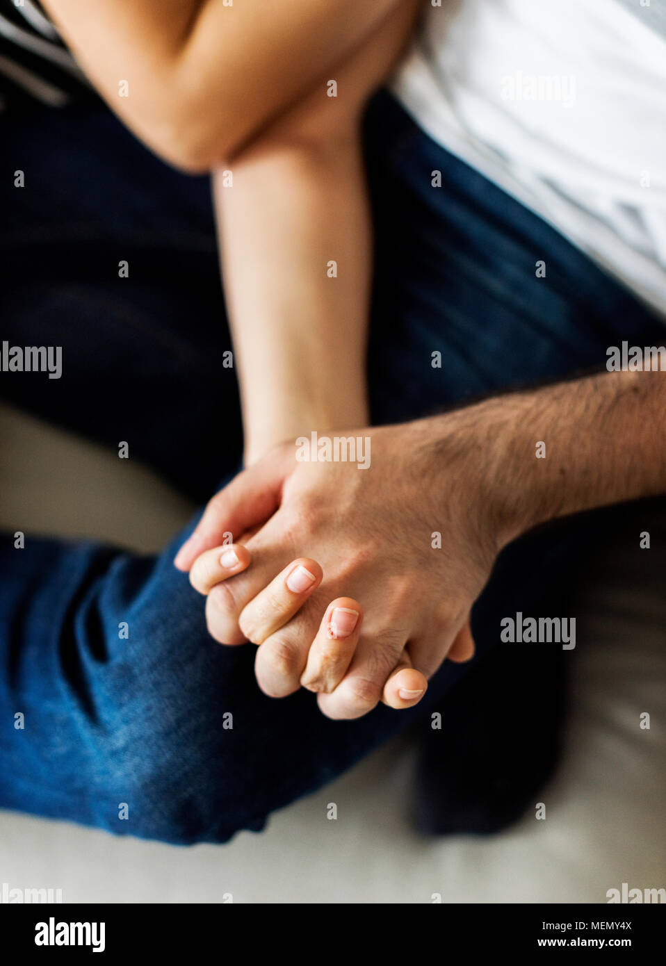 Happy couple relaxing at home Stock Photo