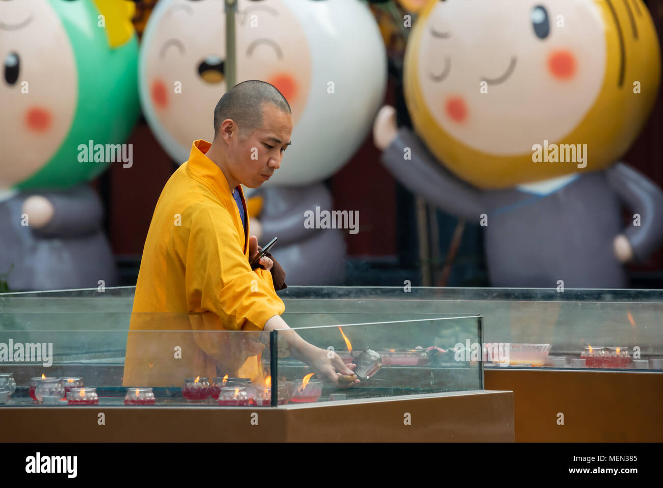 Buddhist monk with candle hi-res stock photography and images - Alamy