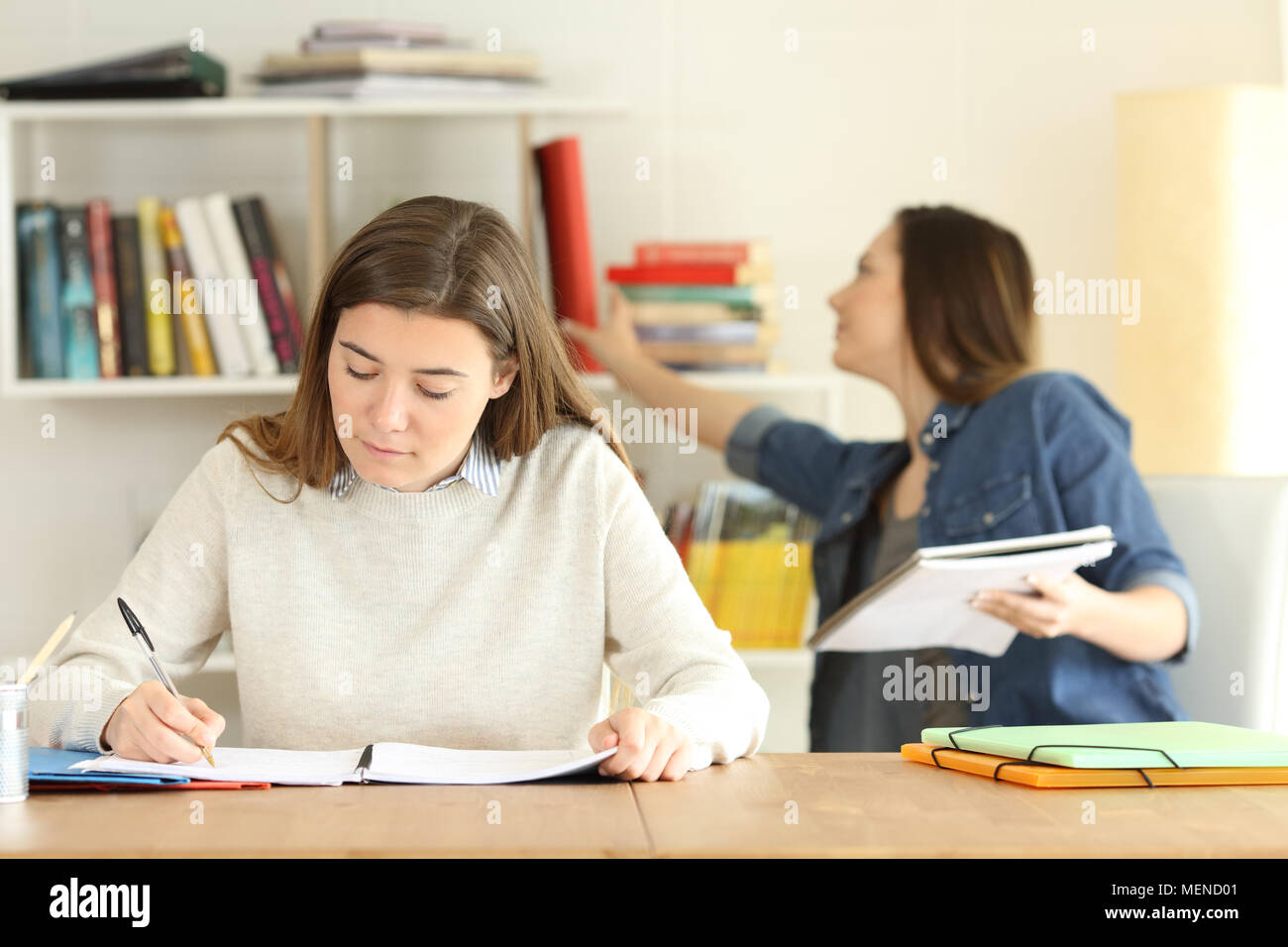 Front view portrait of two college students studying at home Stock Photo