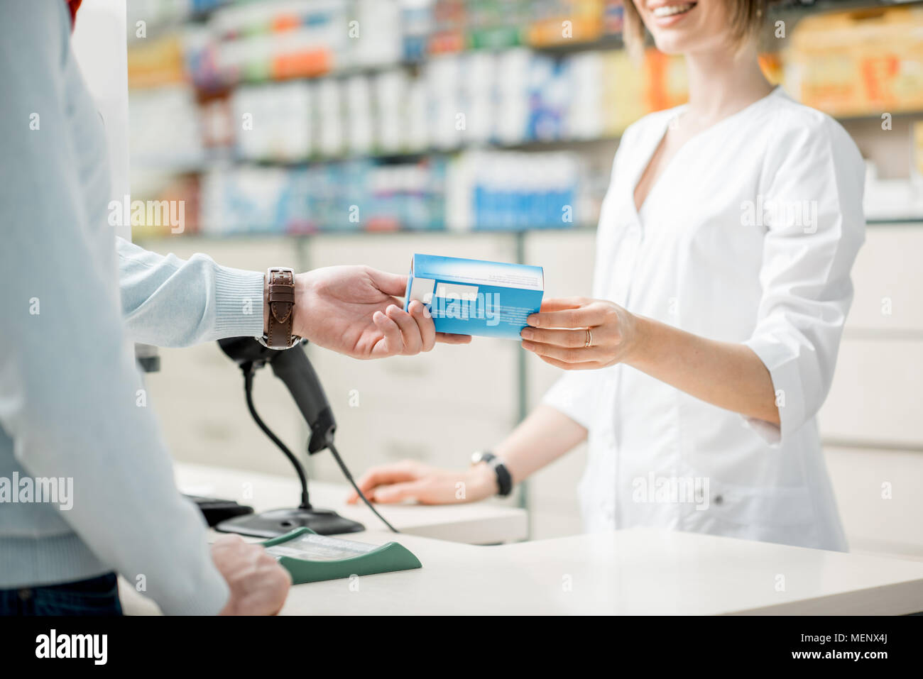 Giving madication at the pharmacy counter Stock Photo - Alamy