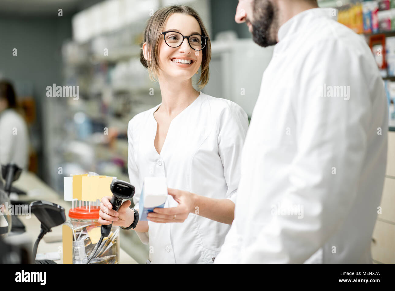 Pharmacists working in the pharmacy store Stock Photo