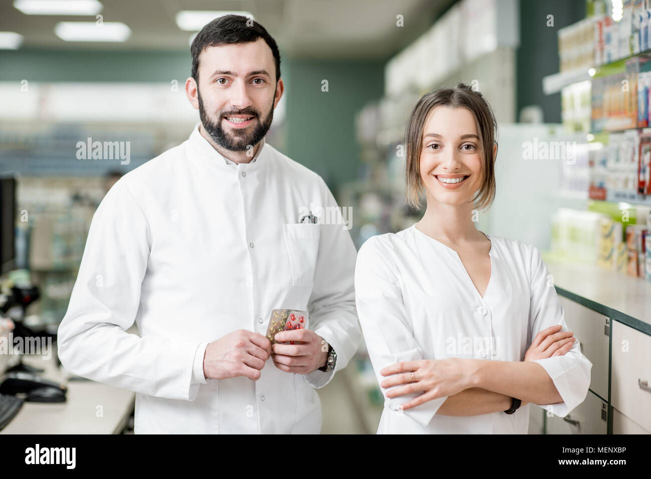 Pharmacists working in the pharmacy store Stock Photo