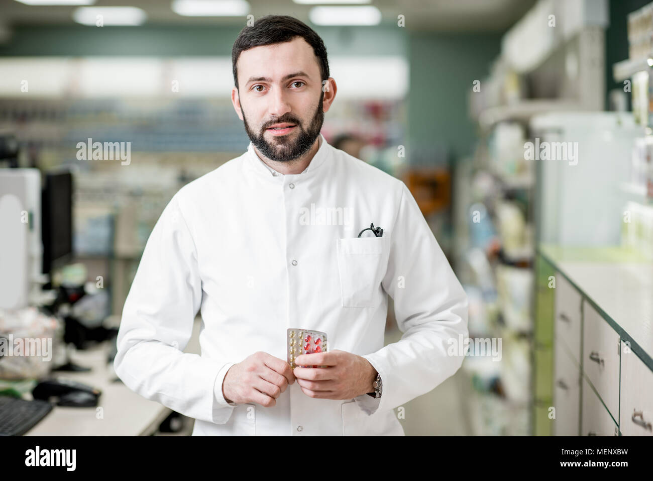 Pharmacist in the pharmacy store Stock Photo