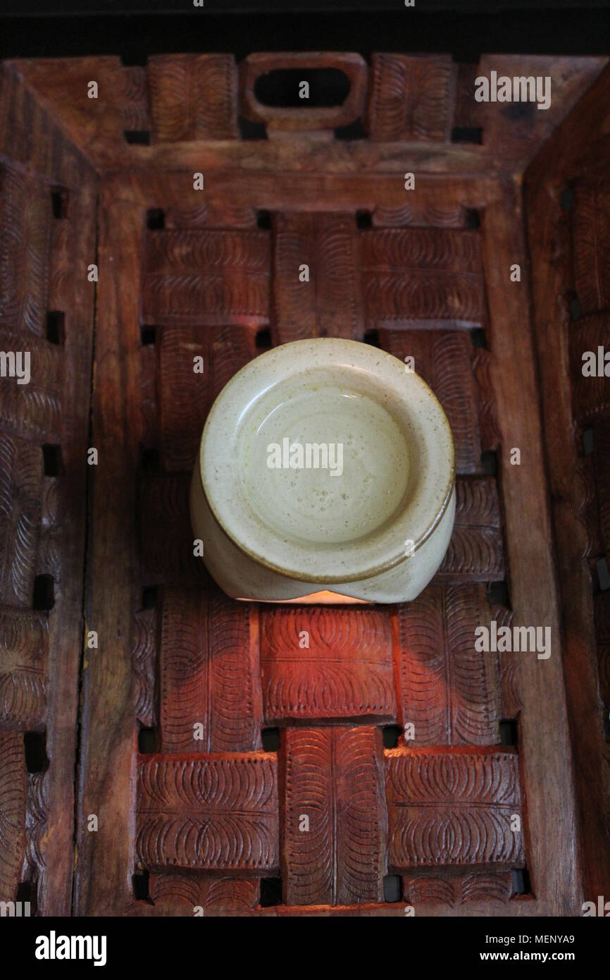 Ceramic diffuser containing natural essential oil diluted with water