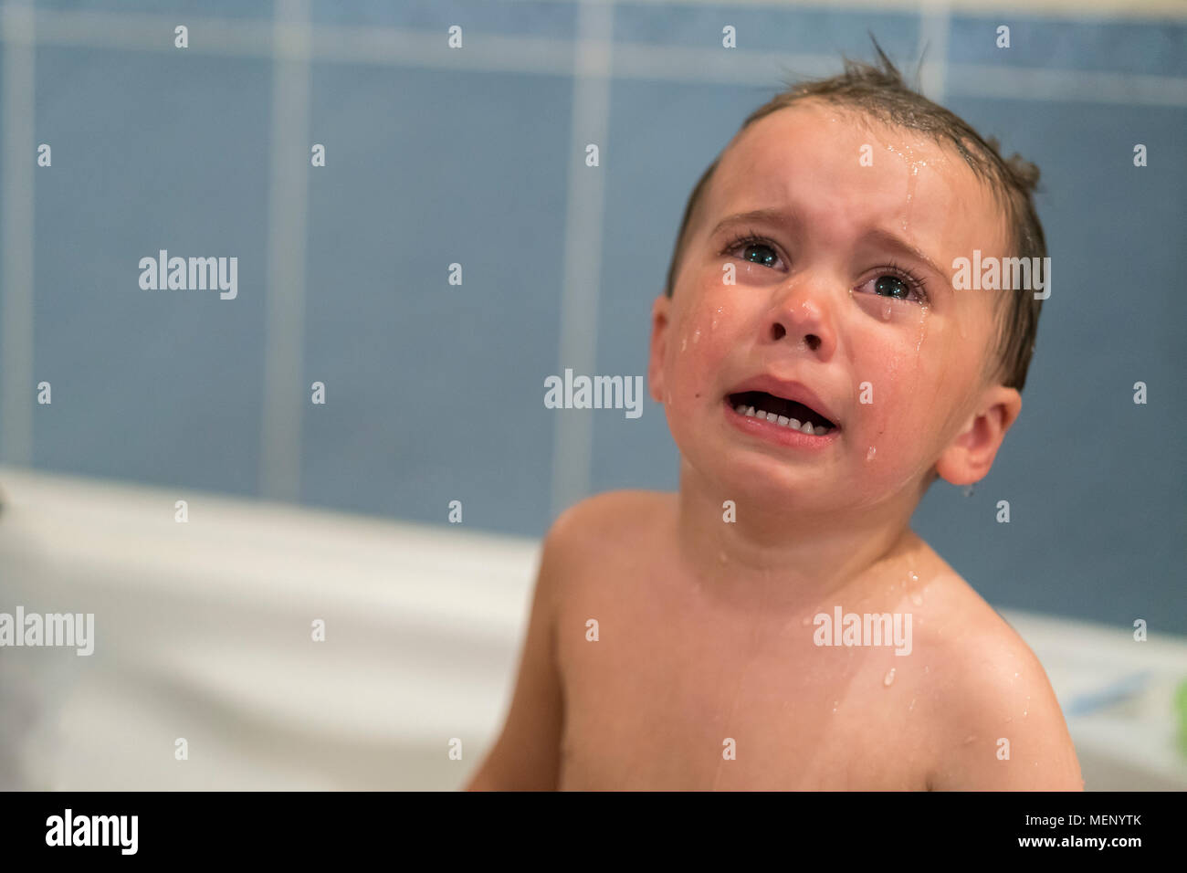 Crying Baby By In A Bathtub Infant Kid Sreaming While Taking A Bath Baby Cries In The Bathroom Stock Photo Alamy