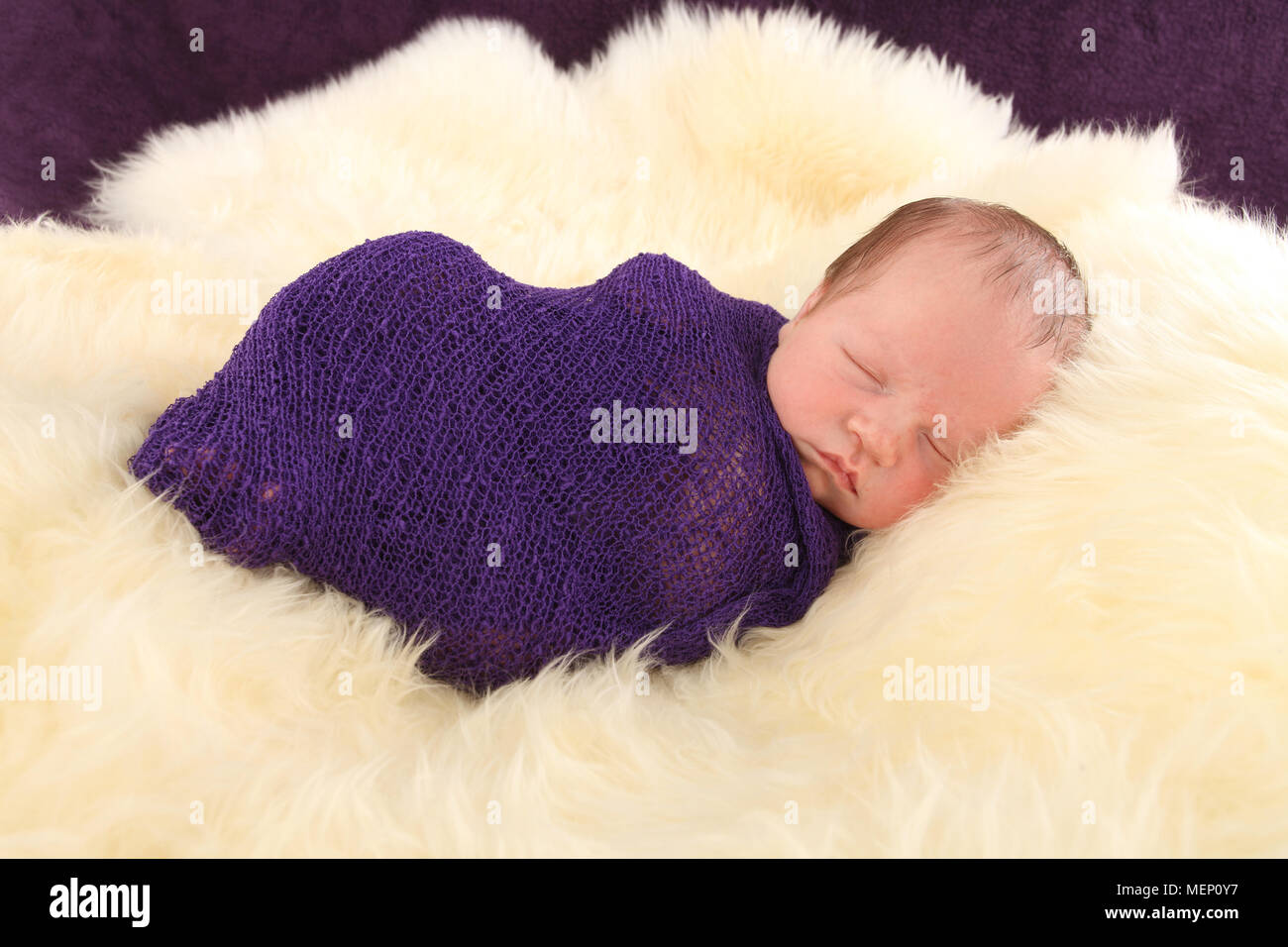 1 week old baby boy sleeping, swaddled in baby wrap Stock Photo Alamy