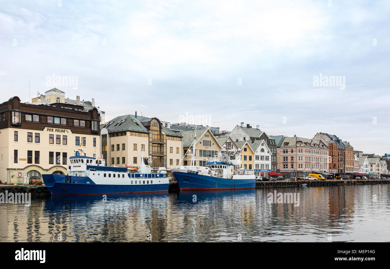 Haugesund, Norway - January 9, 2018: View of the city of Haugesund from the canal. Two ships at the quai. Stock Photo