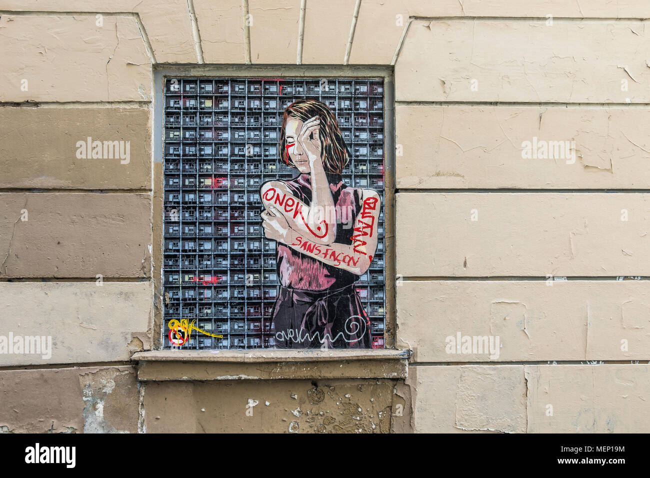 Window with a street painting of a woman folding her arms on the side of a building , Montmartre , Paris Stock Photo