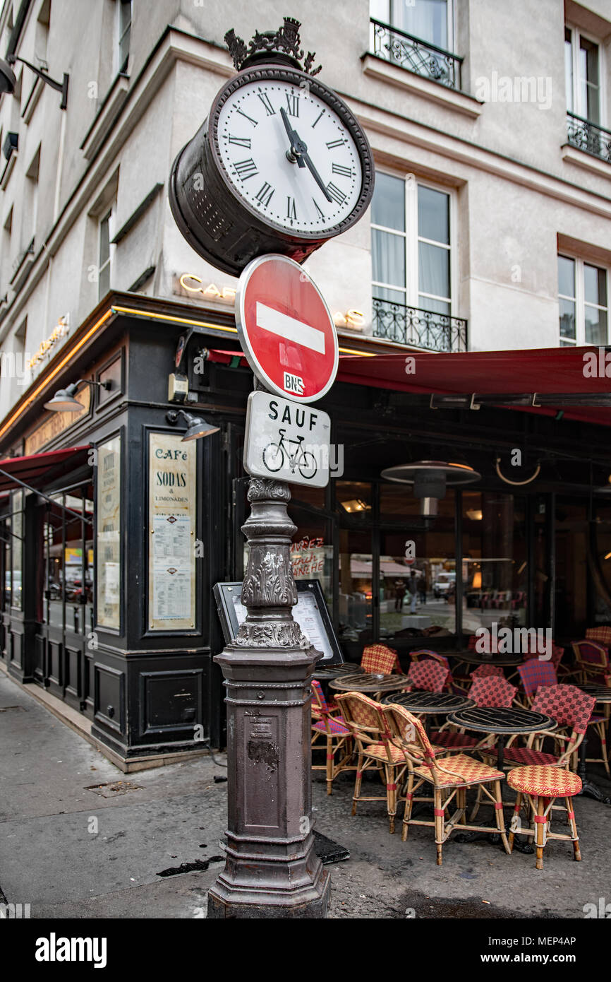 Parisian street clock on famous rue Mouffetard Stock Photo