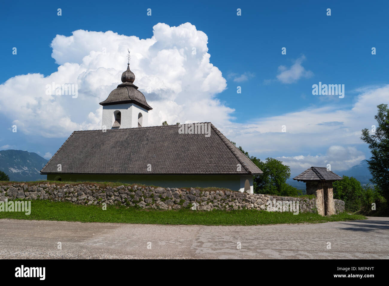 Church of St. Catherine, Zasip, Slovenia, Europe. Typical small historic ancient country mountain Saint Catherine church, slovenian Alps. Mountain slo Stock Photo
