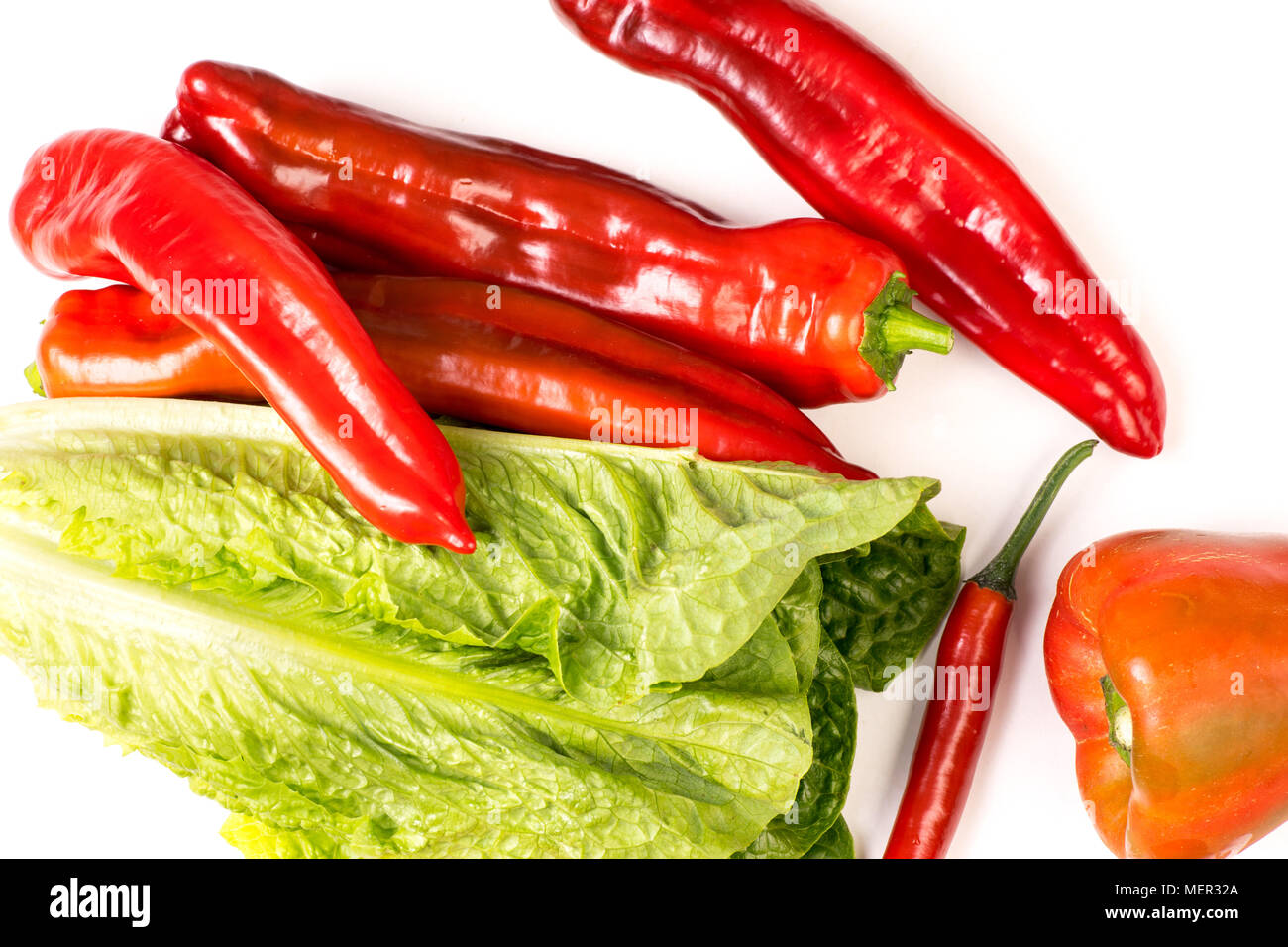 Organic Red Chili, Snack and Bell Pepper and Green Romaine lettuce, isolated on white background Stock Photo