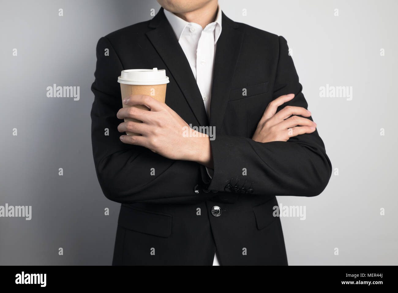 business man holding a paper cup Stock Photo - Alamy