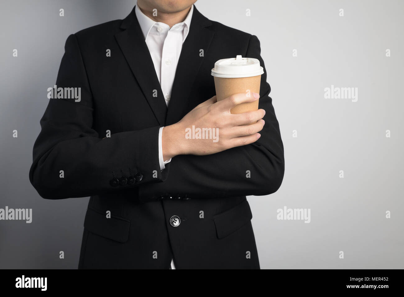 business man holding a paper cup Stock Photo - Alamy