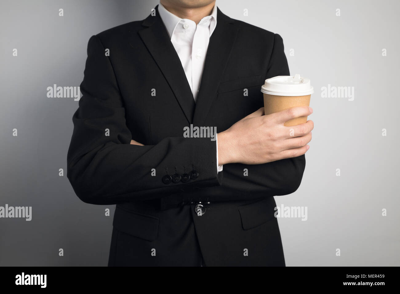 business man holding a paper cup Stock Photo