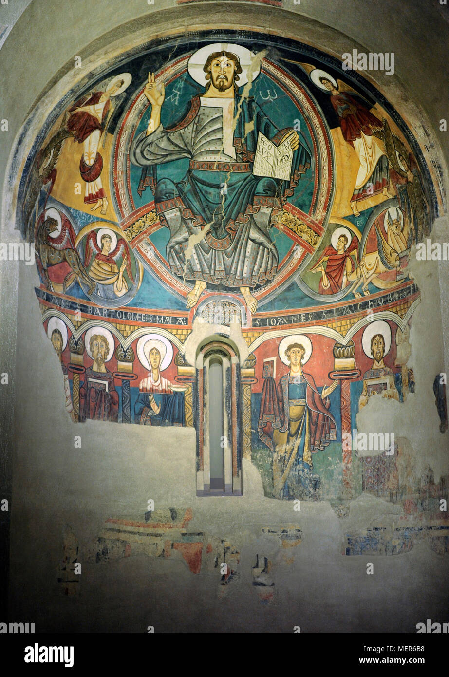 Master of Taull. Apse of Sant Climent de Taull, 1123. Romanesque. Fresco depicting Christ in Majesty in the mandorla and the Tetramorph. In the lower part, apostles and the Virgin Mary. Fresco transferred to canvas. From the Church of Sant Climent de Taull, province of Lleida. National Museum of Art of Catalonia (MNAC). Barcelona. Catalonia. Spain. Stock Photo
