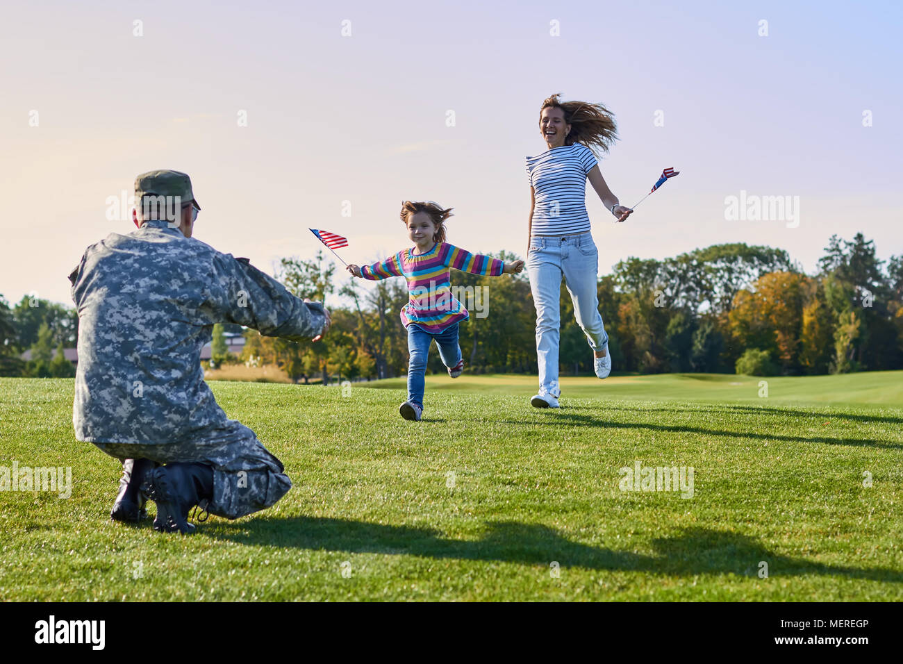 Woman and daughter are meeting soldier in uniform Stock Photo Alamy
