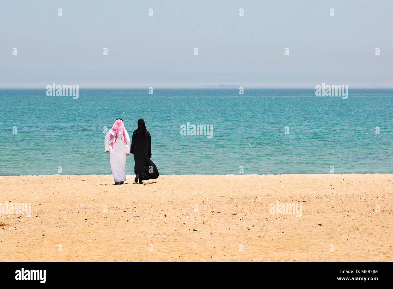 Kuwaiti couple on a beach in Kuwait Stock Photo