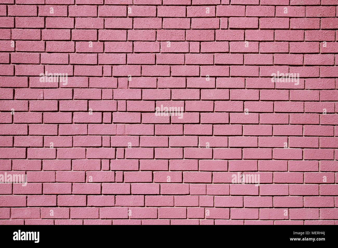 Brick wall, red painted brick wall close-up Stock Photo