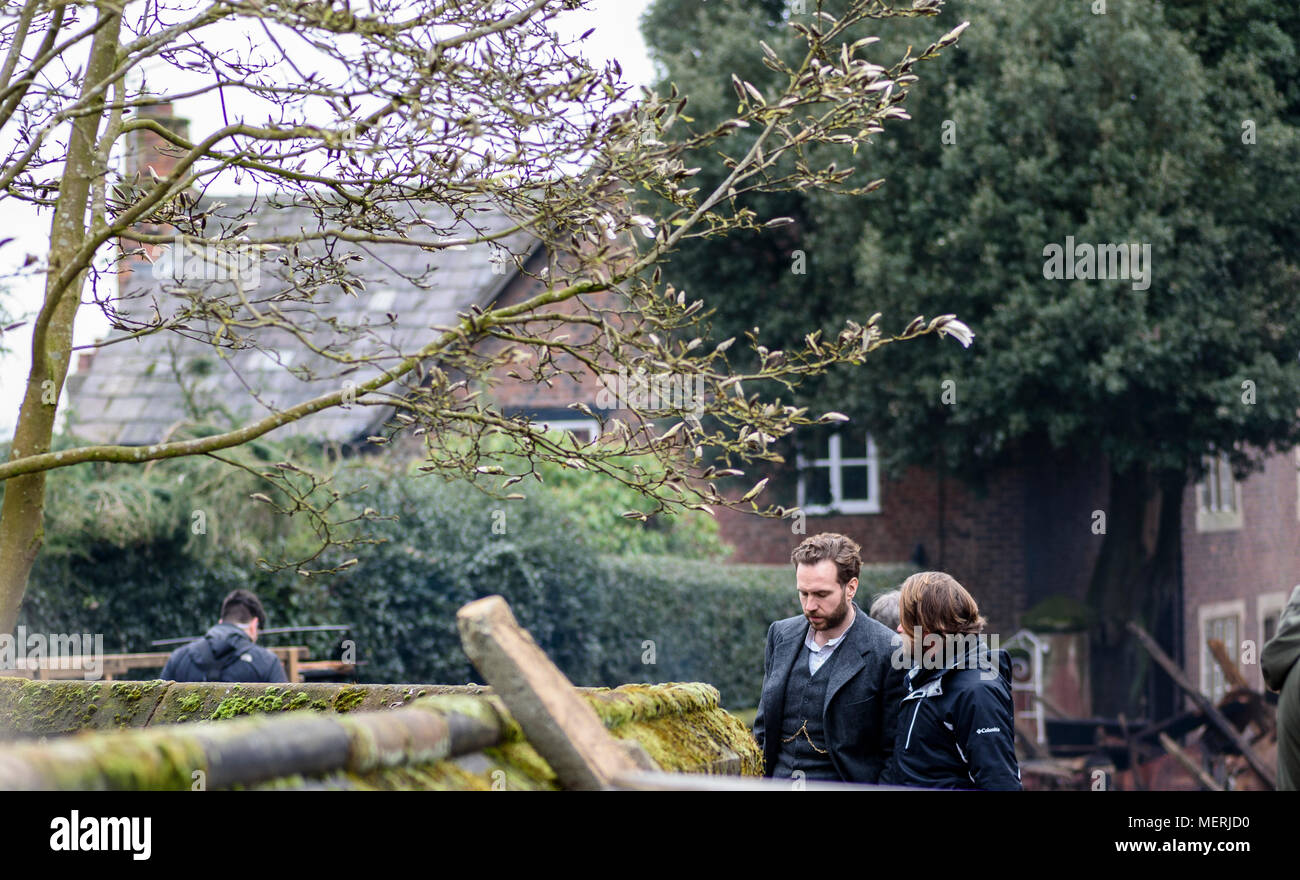 Great Budworth, UK. 11th April, 2018. Actor Rafe Spall talks on set to director Craig Viveiros in the new BBC drama 'War Of The Worlds' by HG Wells, f Stock Photo