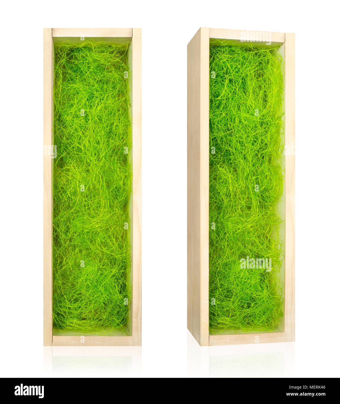 Open wooden box for vine filled with decorative green sisal. Isolated on white. Path included. Stock Photo