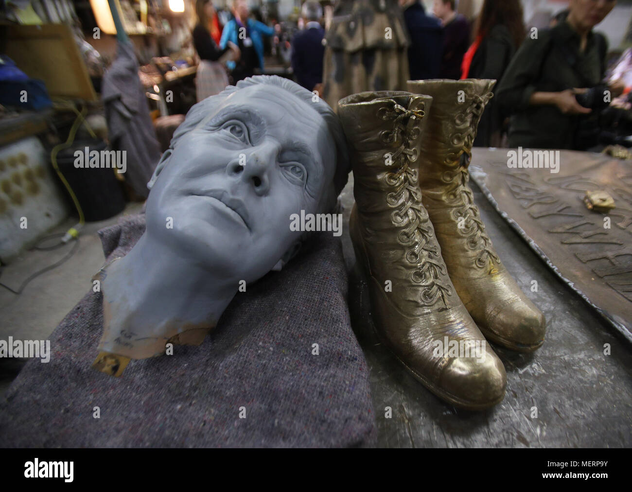 Embargoed to 0001 Tuesday April 24 A 3D-printed head - used as a starting point to model the finished head of the statue - alongside a pair of boots that will be fitted to an unfinished statue of suffragist leader Millicent Fawcett at AB Fine Art Foundry, east London, before its unveiling in Parliament Square. Stock Photo