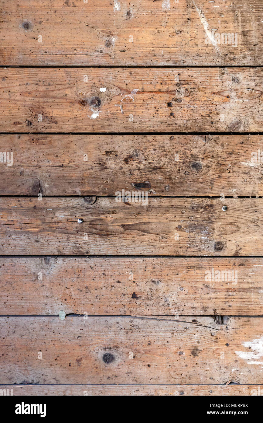 Rustic weathered barn wood background with knots and nail holes Stock Photo
