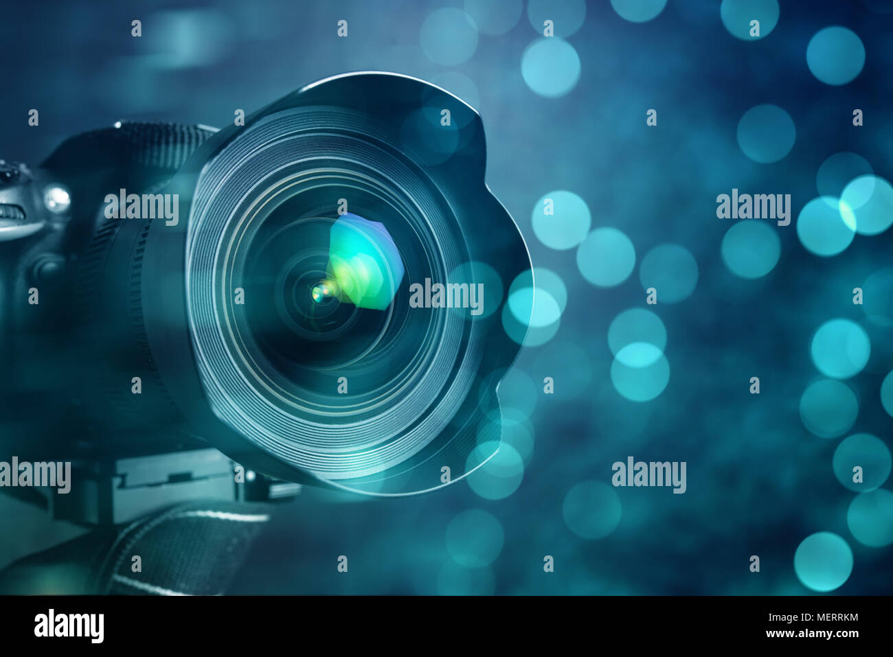 Closeup of a digital camera and shiny bokeh background Stock Photo