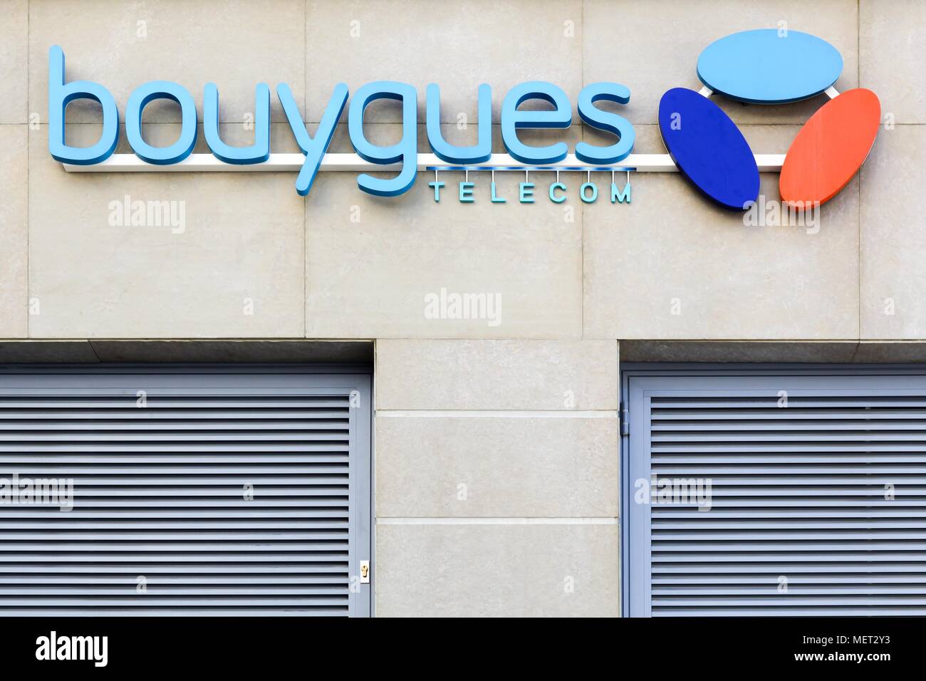 Lyon, France - August 15, 2016:  Bouygues Telecom logo on wall of a store. Bouygues Telecom is a French mobile phone and Internet service provider Stock Photo